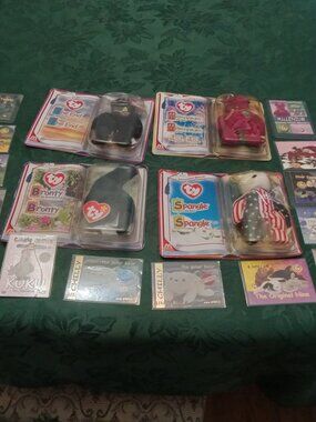 Set of four McDonald's Ty Beanie Babies in packages and collector cards